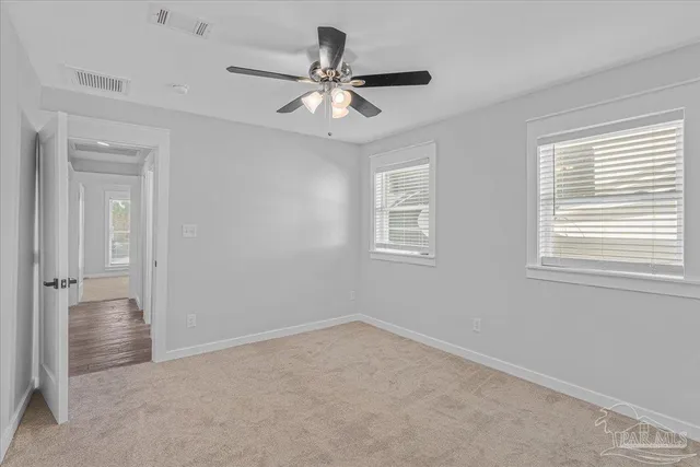 a view of an empty room and window