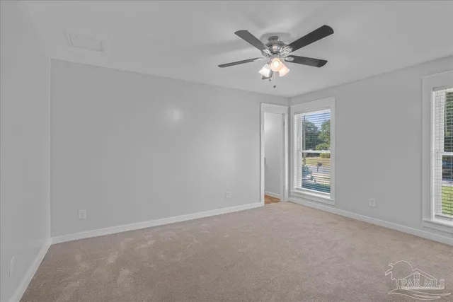 a bathroom with a toilet a sink and shower
