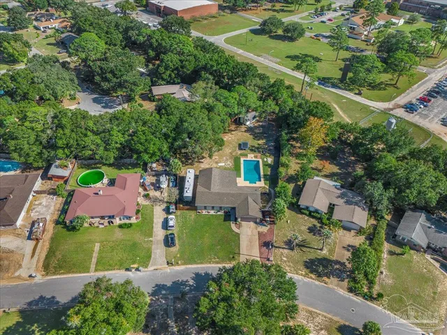 an aerial view of house with a yard