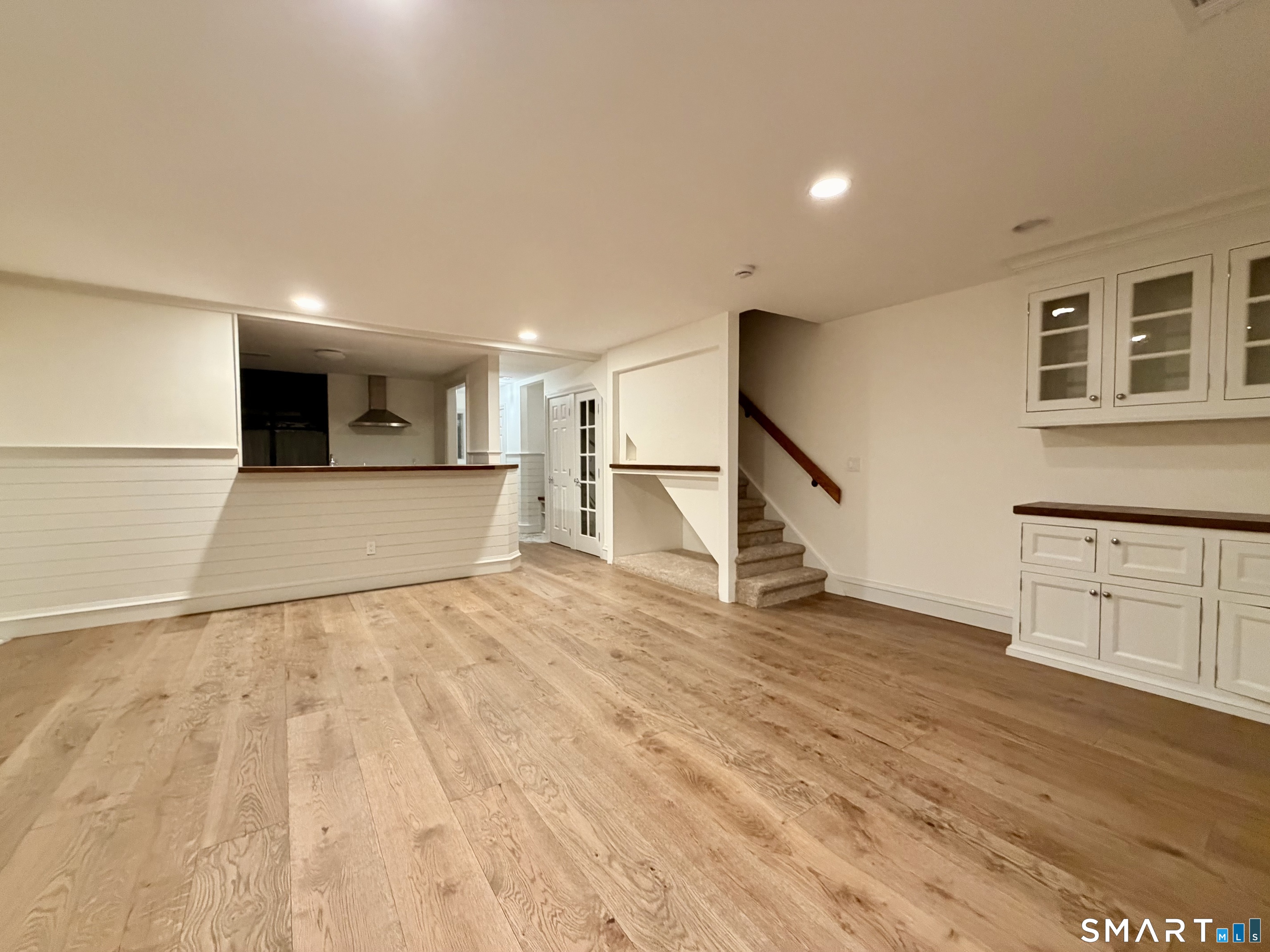 123 Old Belden Hill Road, Unit 19 Norwalk, CT 06850 - Photo 15 of 31 a view of an empty room with wooden floor and a window