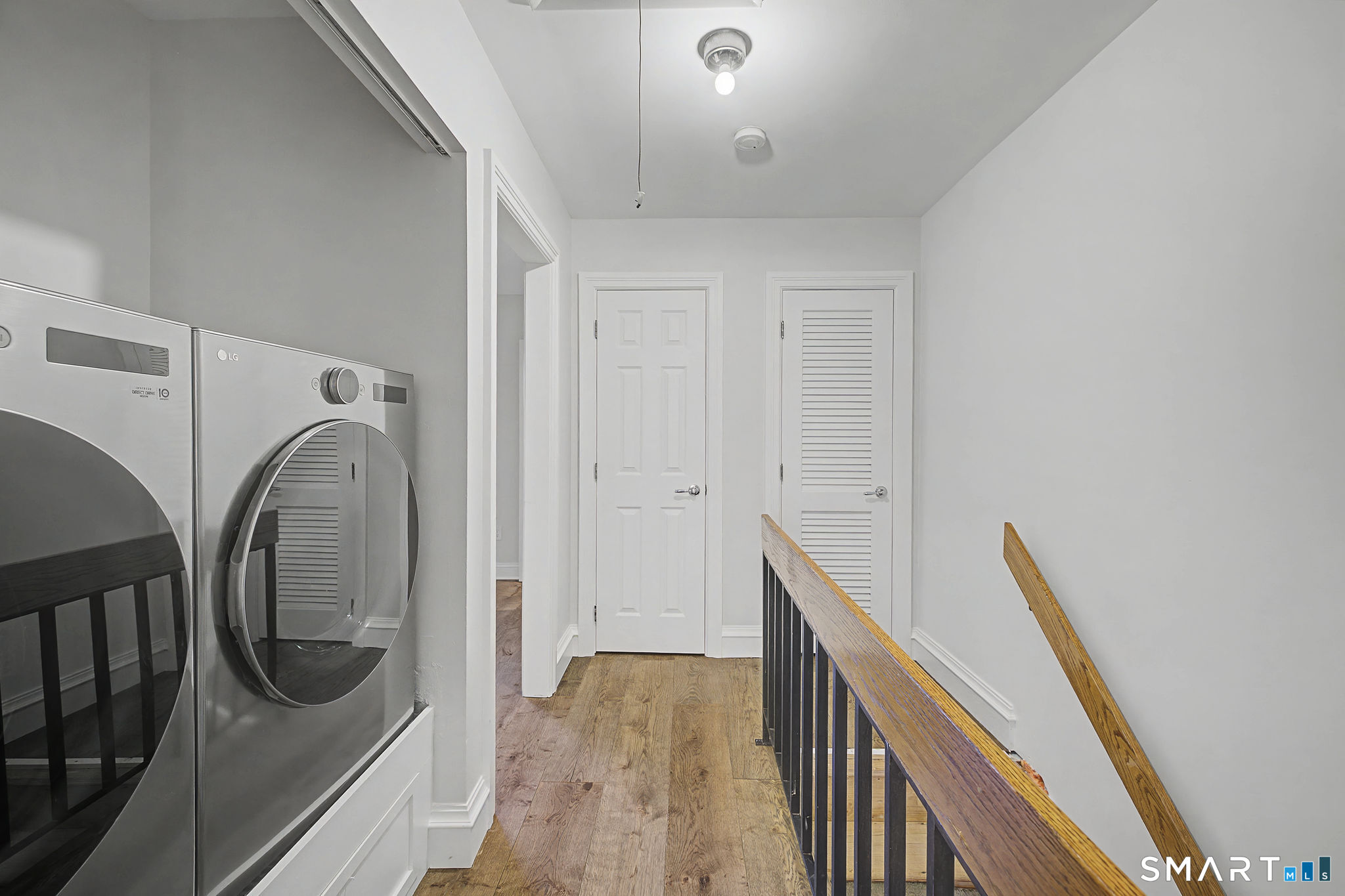 123 Old Belden Hill Road, Unit 19 Norwalk, CT 06850 - Photo 17 of 31 a view of a hallway with wooden floor and staircase