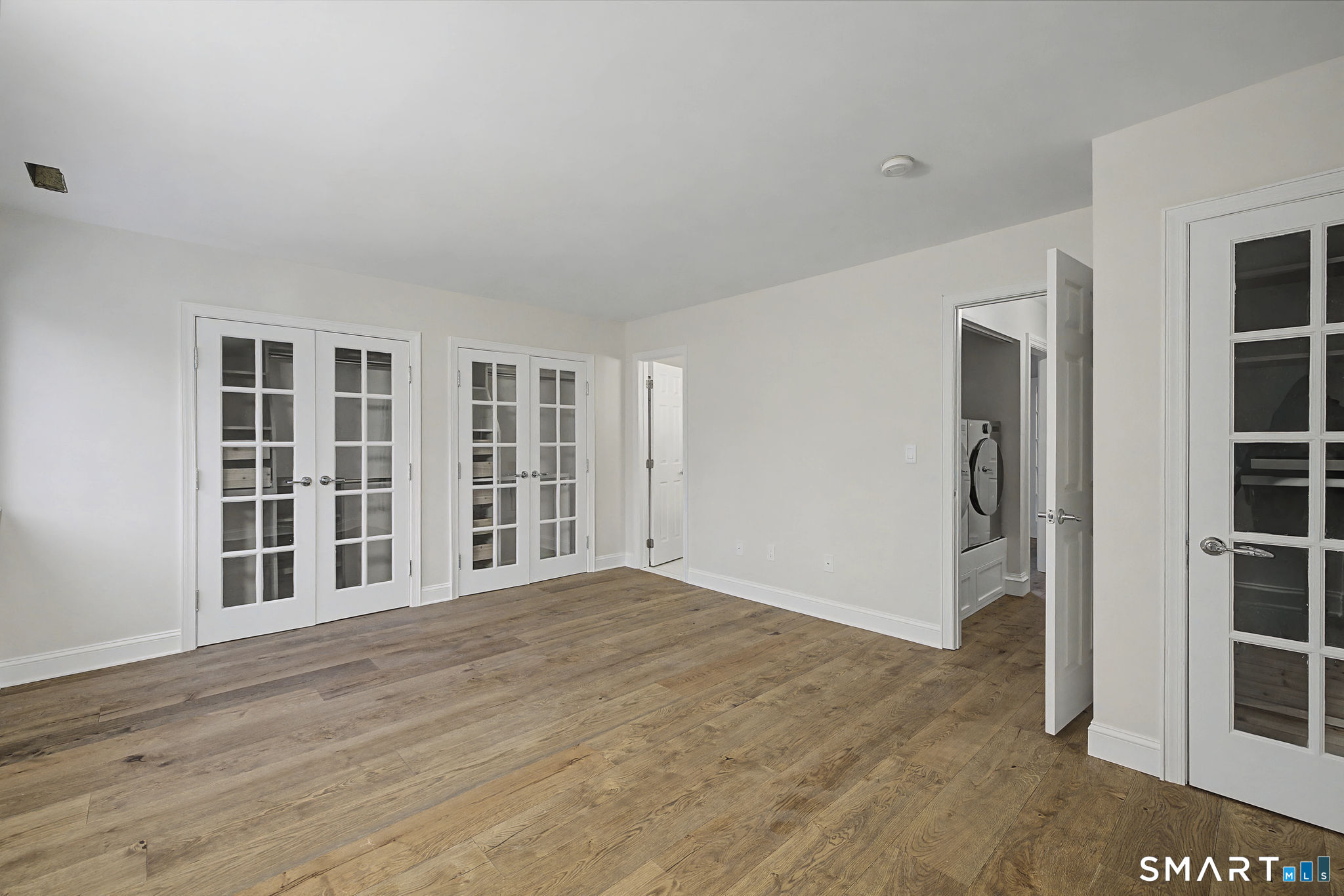123 Old Belden Hill Road, Unit 19 Norwalk, CT 06850 - Photo 19 of 31 wooden floor in an empty room with a window