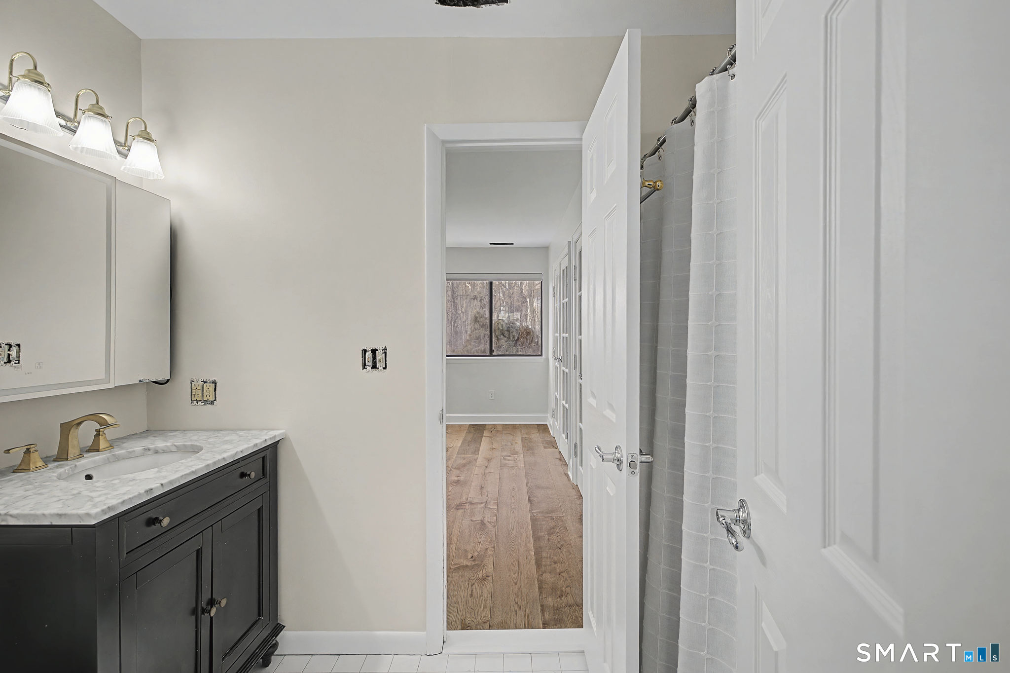 123 Old Belden Hill Road, Unit 19 Norwalk, CT 06850 - Photo 20 of 31 a bathroom with a sink and mirror