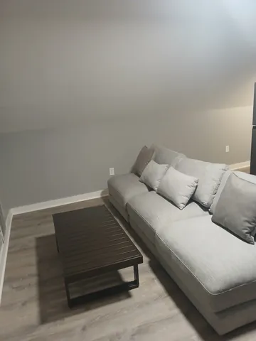 a bed sitting in a bedroom and lamp