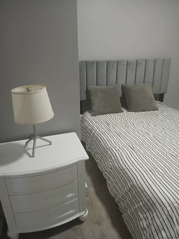 a living room with a couch and a window