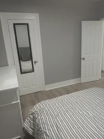 a bathroom with a bathtub and shower