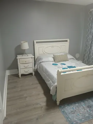 a view of a livingroom with wooden floor