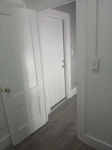 a bedroom with a bed and toilet