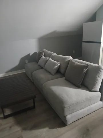 a living room with furniture and a couch