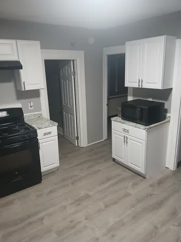 a kitchen with a stove and a refrigerator