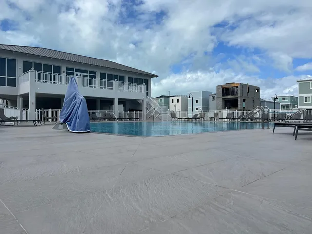 a view of house with outdoor space and parking