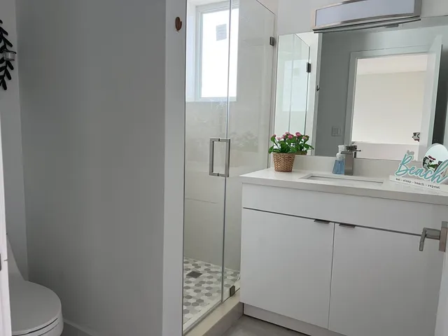 a bathroom with a sink and mirror