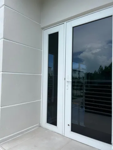 a bathroom with a glass shower door