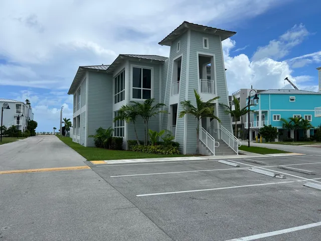 a view of a house with a yard and plants