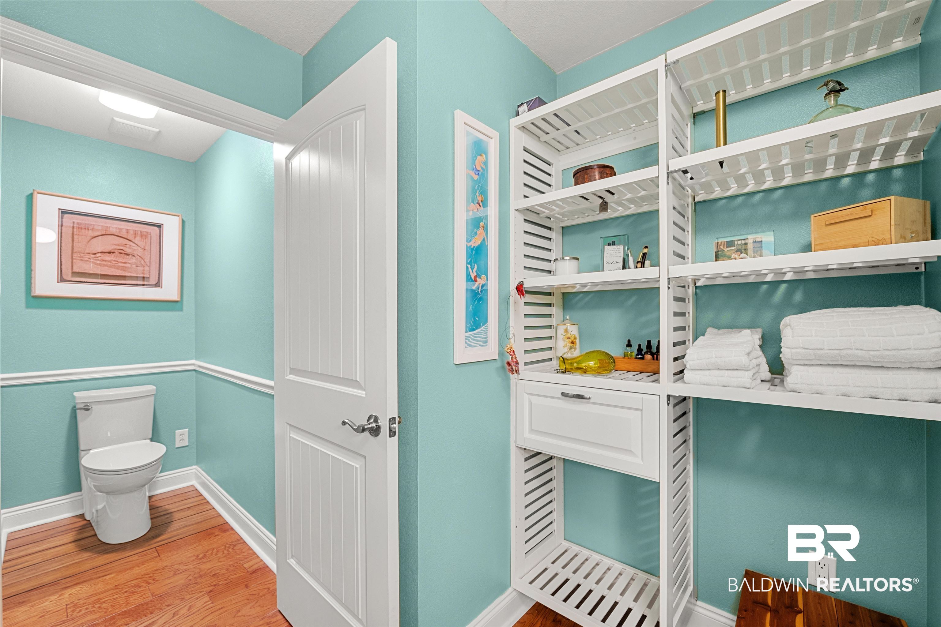 1850 Arcadia Drive Foley, AL 36535 - Photo 26 of 44 Interior space featuring toilet, baseboards, and wood finished floors