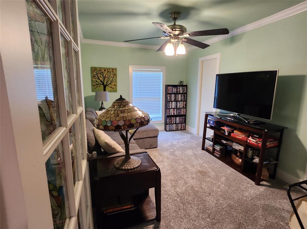 1023 Ridgefield Drive Plano, TX 75075 - Photo 19 of 39 a living room with furniture and a flat screen tv
