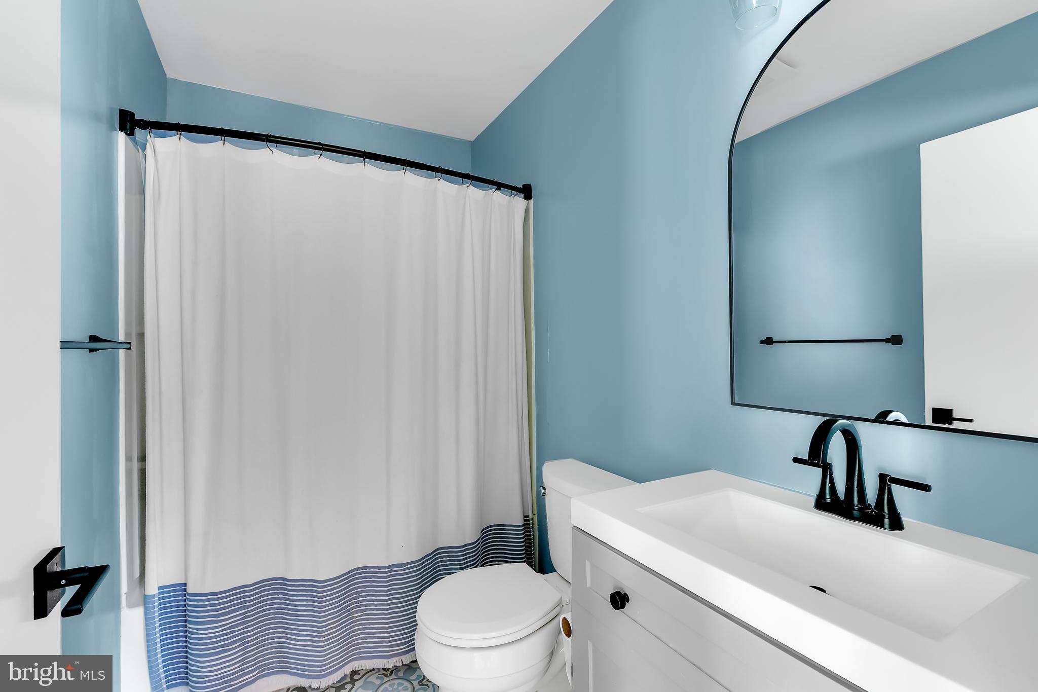 5 Mist Flower Road Ocean Pines, MD 21811 - Photo 26 of 41 a bathroom with a sink a toilet and shower