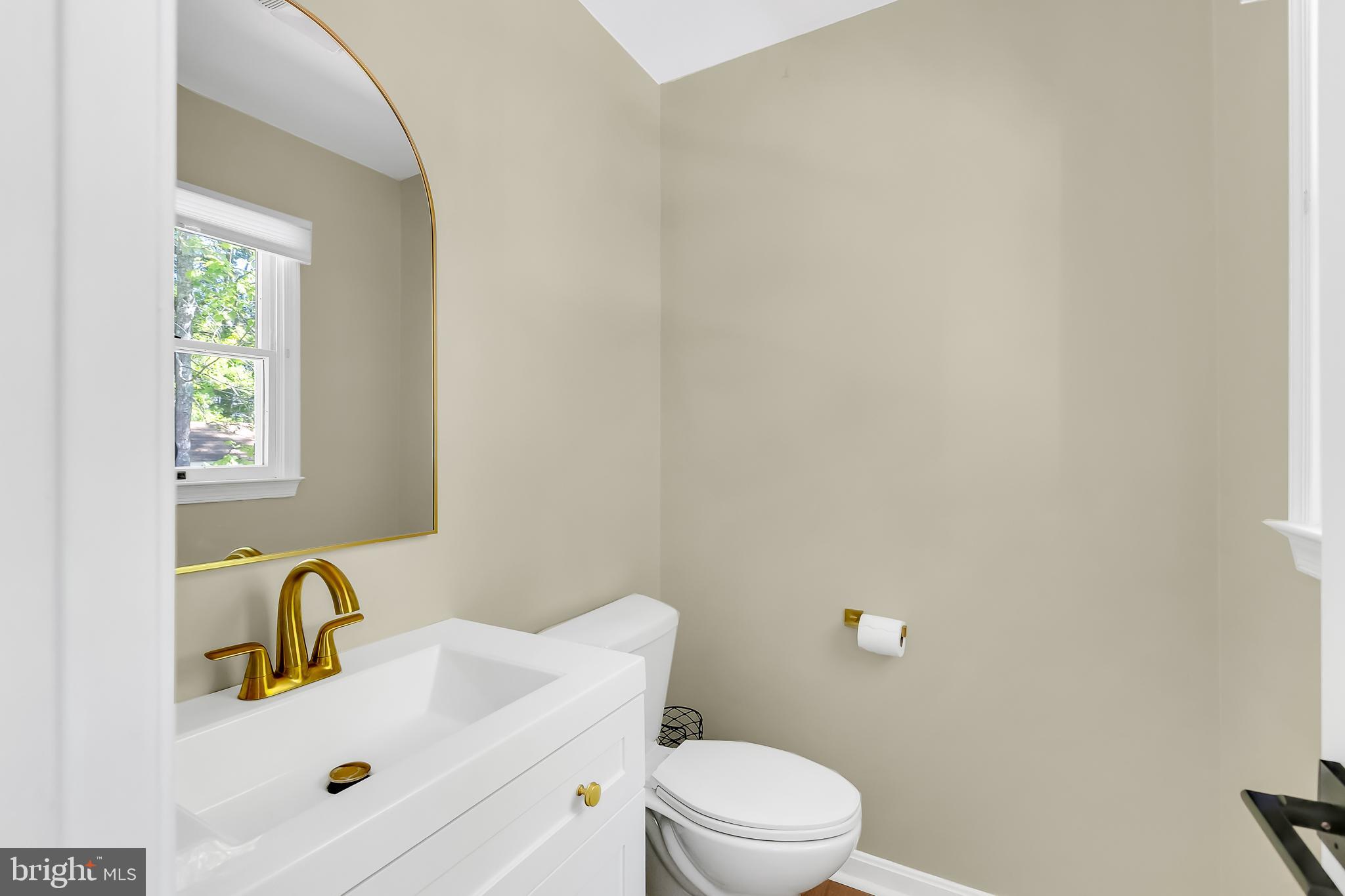 5 Mist Flower Road Ocean Pines, MD 21811 - Photo 29 of 41 a bathroom with a sink mirror and toilet