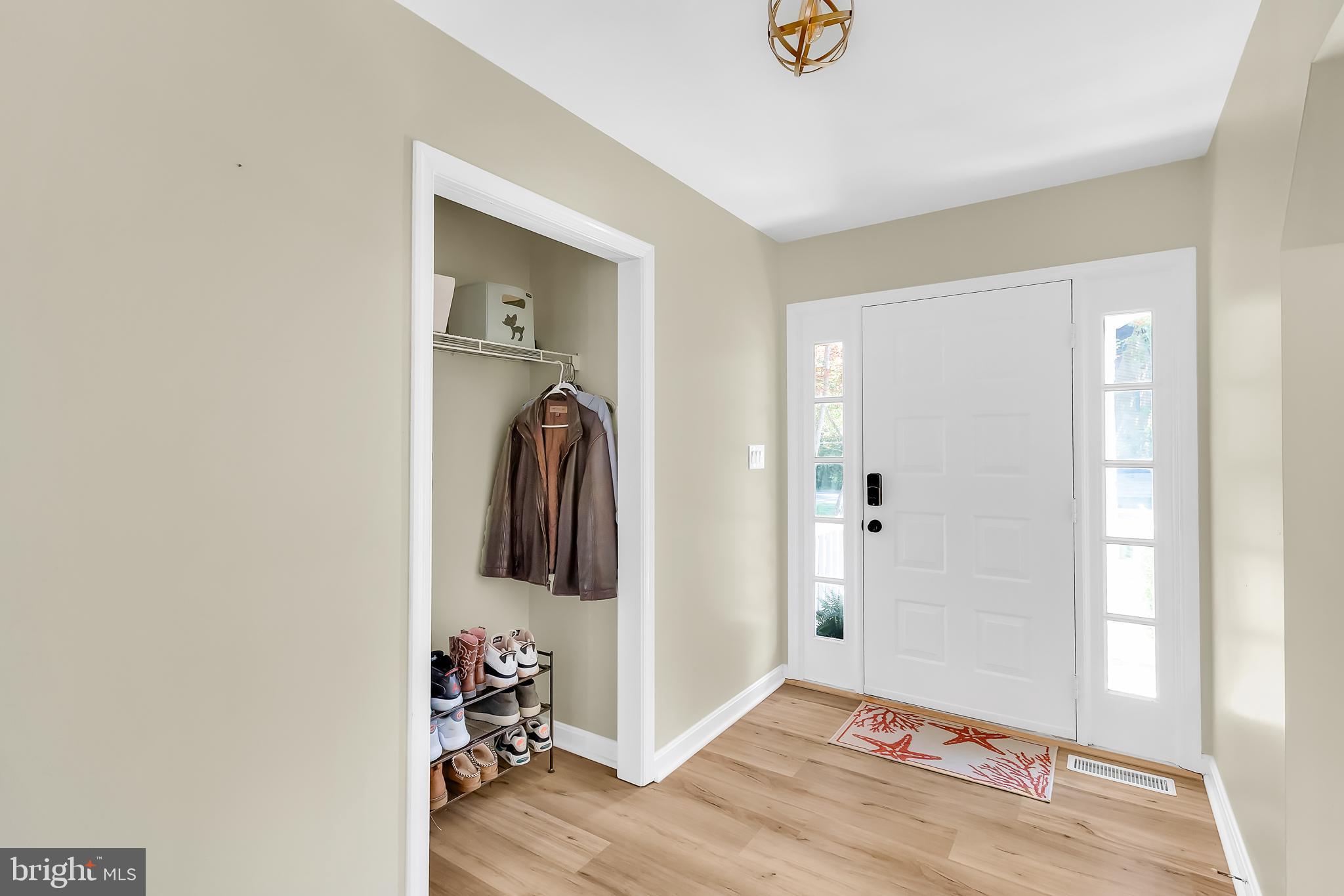 5 Mist Flower Road Ocean Pines, MD 21811 - Photo 6 of 41 a view of a hallway with bathroom and wooden floor