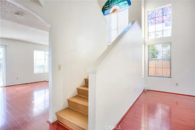 a view of an entryway with wooden floor
