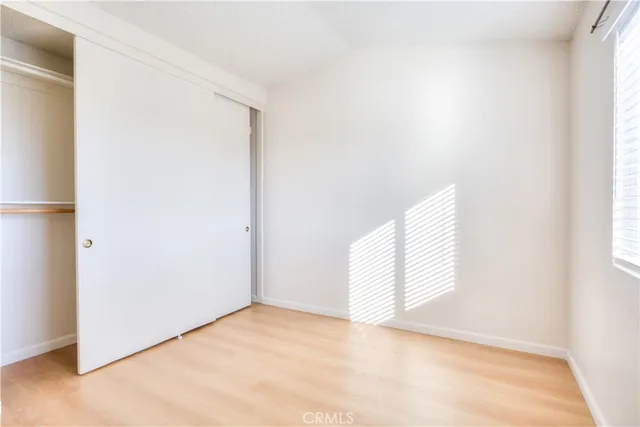 a view of an empty room and a window