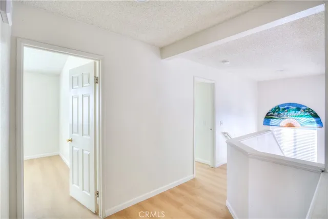 a view of kitchen with wooden floor washer and dryer