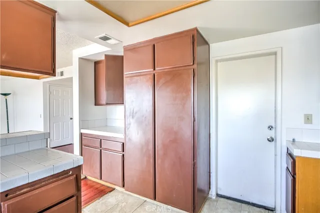 a bathroom with a shower sink and mirror