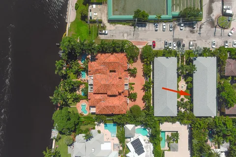 an aerial view of a house with a yard and garden