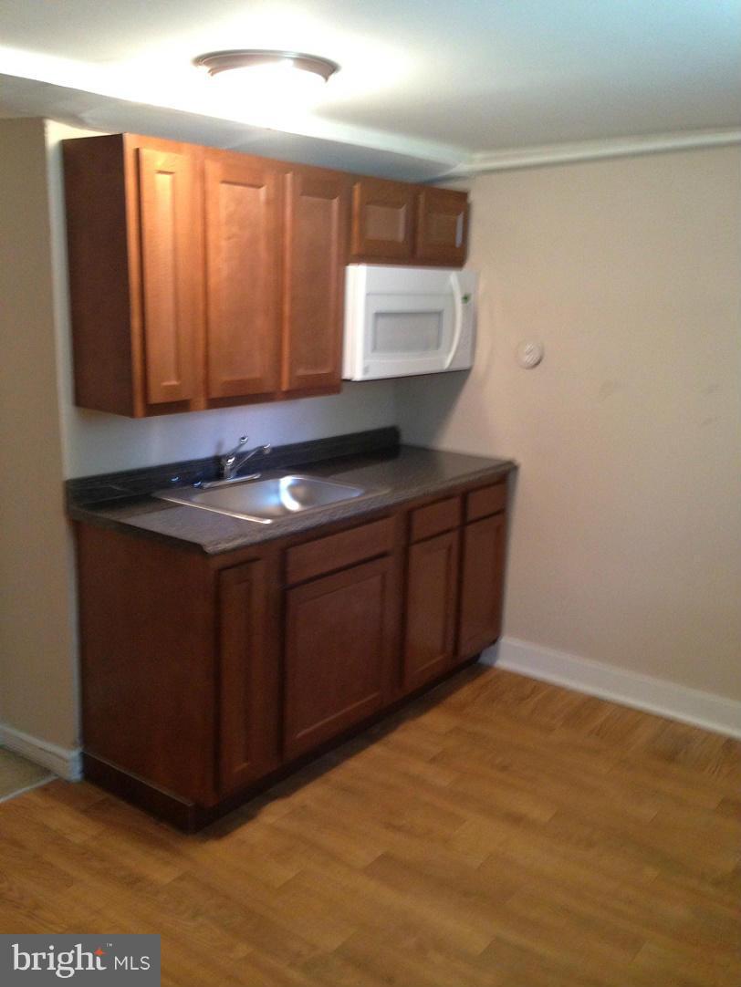 5901 Ravenswood Road Riverdale, MD 20737 - Photo 18 of 29 Kitchenette w/ new cabinets & granite top