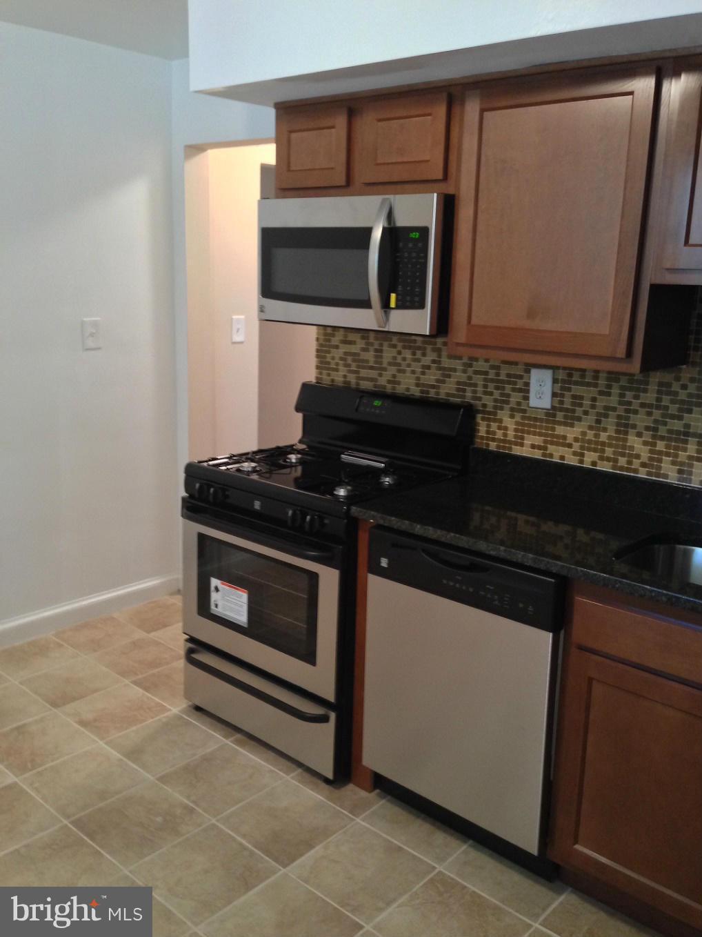 5901 Ravenswood Road Riverdale, MD 20737 - Photo 4 of 29 New Kitchen w/ granite top & CT floors