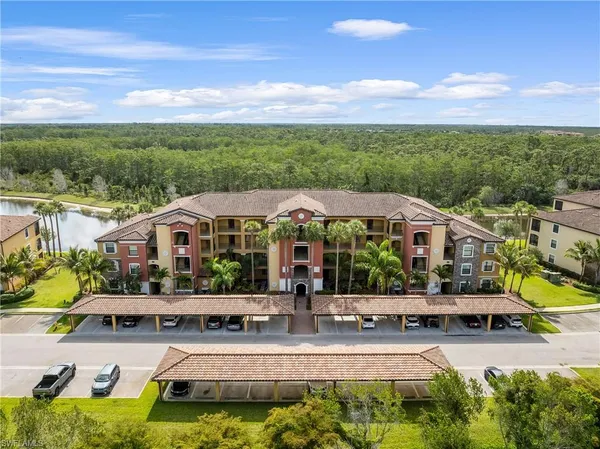a aerial view of a house with swimming pool garden and patio