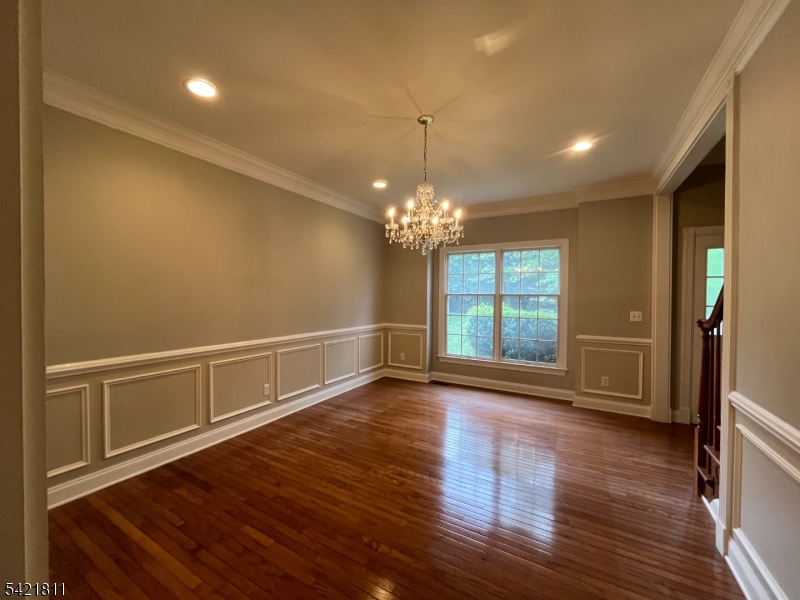 43 Georgetown Court Bernards, NJ 07920 - Photo 13 of 13 a view of an empty room with wooden floor and a window