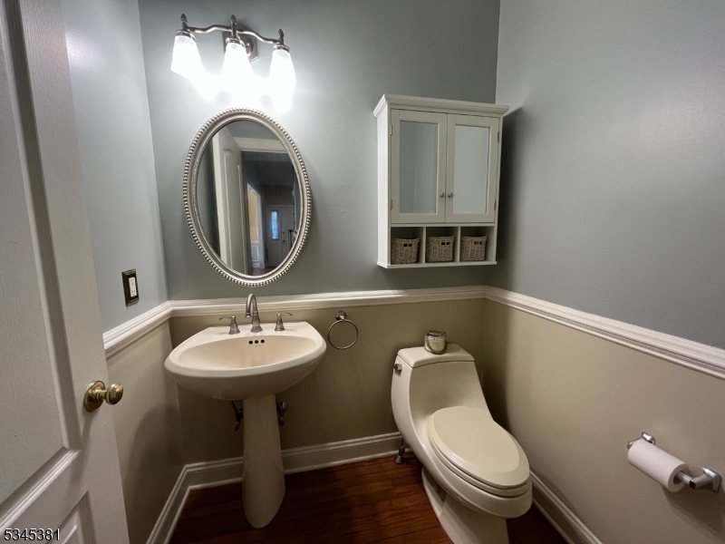 43 Georgetown Court Bernards, NJ 07920 - Photo 5 of 13 a bathroom with a toilet sink and mirror