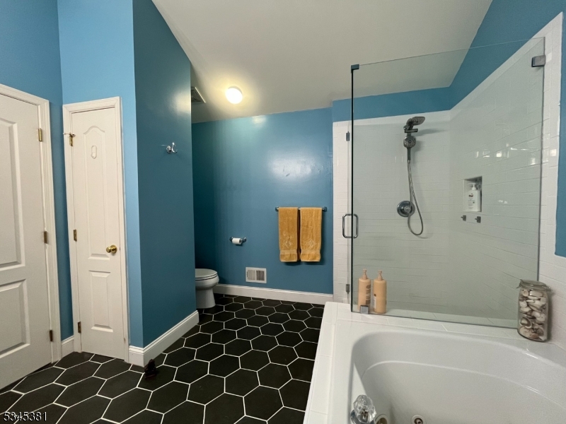 43 Georgetown Court Bernards, NJ 07920 - Photo 7 of 13 a bathroom with a bathtub and a shower