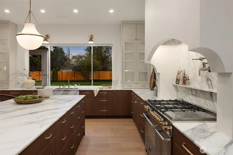 a kitchen with a sink and a refrigerator
