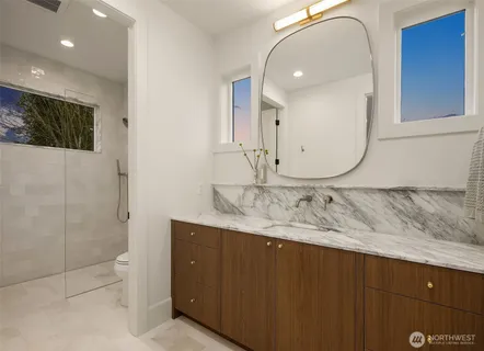 a utility room with cabinets dryer and washer