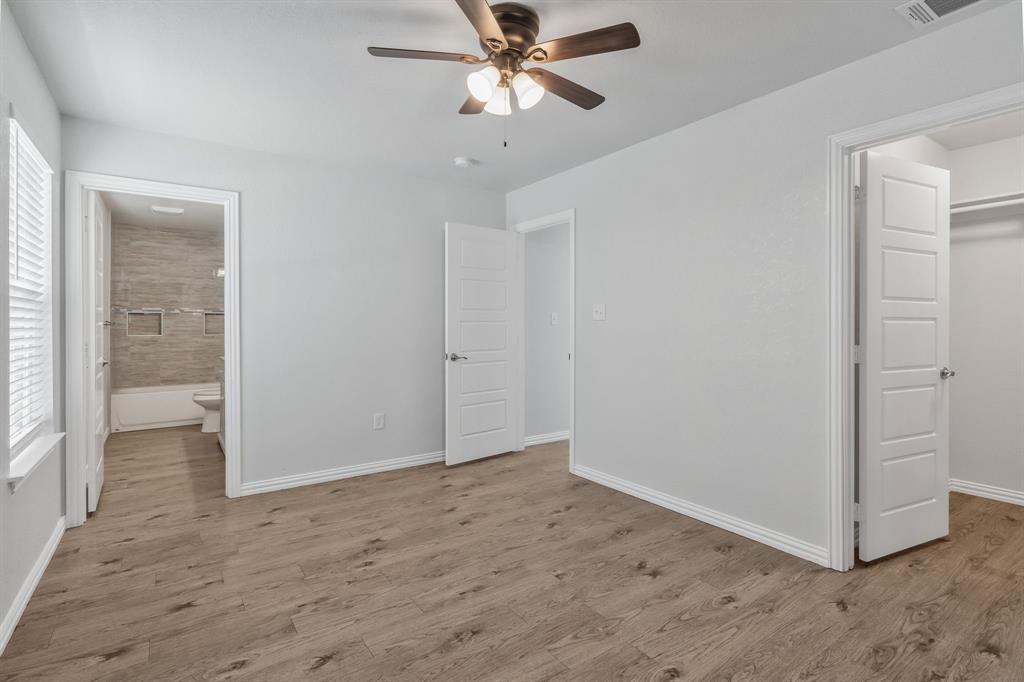 7718 Fm 1886 Azle, TX 76020 - Photo 12 of 16 a view of a livingroom with a ceiling fan and window