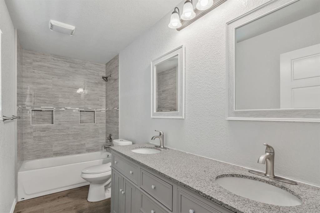 7718 Fm 1886 Azle, TX 76020 - Photo 13 of 16 a bathroom with a granite countertop sink toilet mirror and bathtub