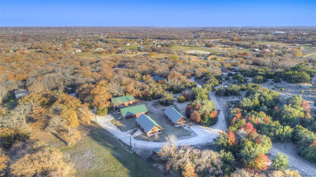 7718 Fm 1886 Azle, TX 76020 - Photo 16 of 16 an aerial view of residential houses with outdoor space