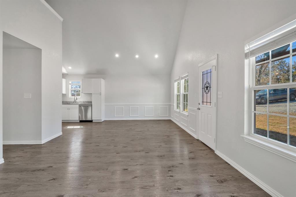 7718 Fm 1886 Azle, TX 76020 - Photo 6 of 16 a view of empty room with wooden floor and windows