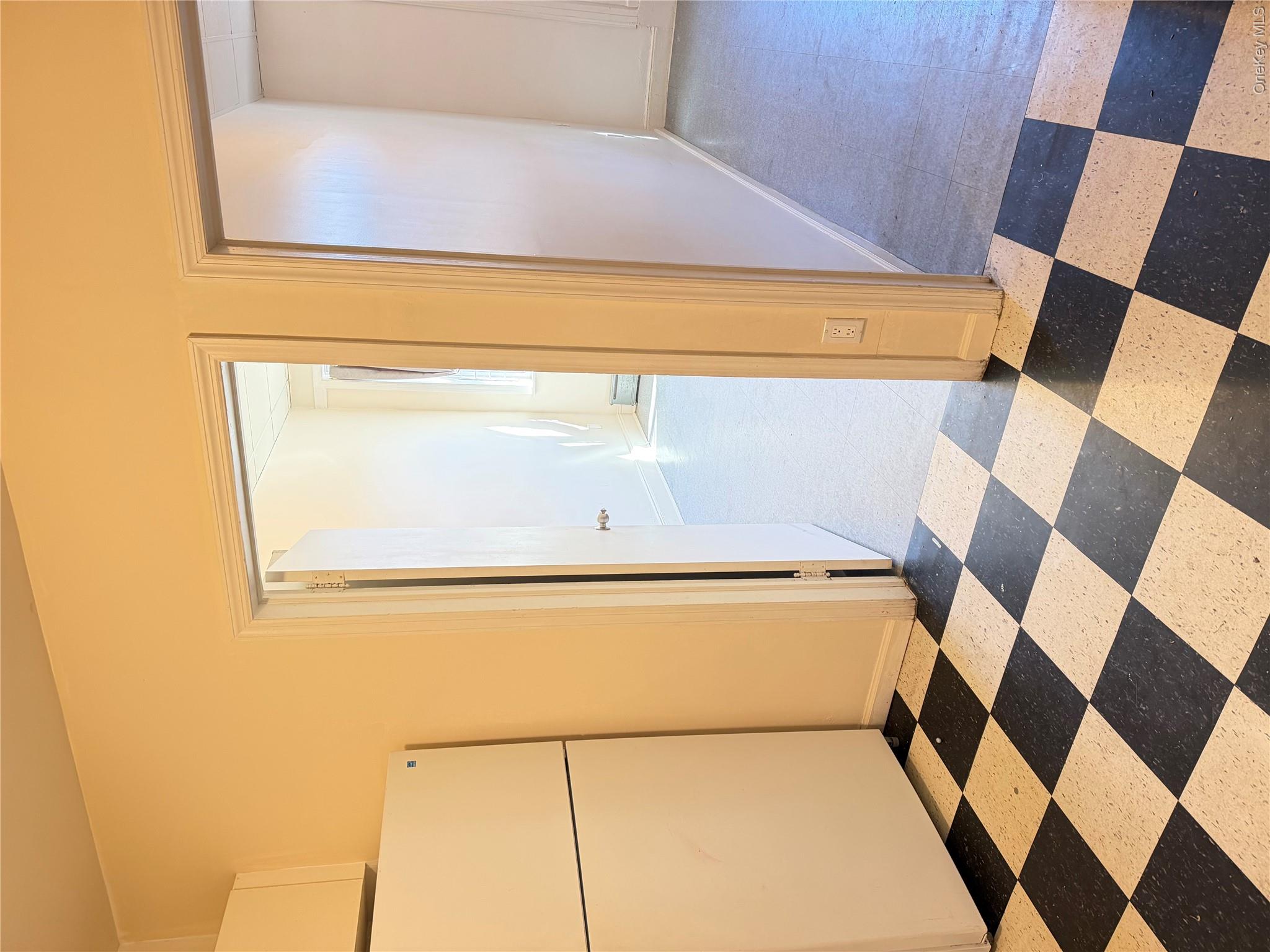 50-05 108th Street Queens, NY 11368 - Photo 12 of 16 a view of a black and white checkered floor with a black white checkered floor