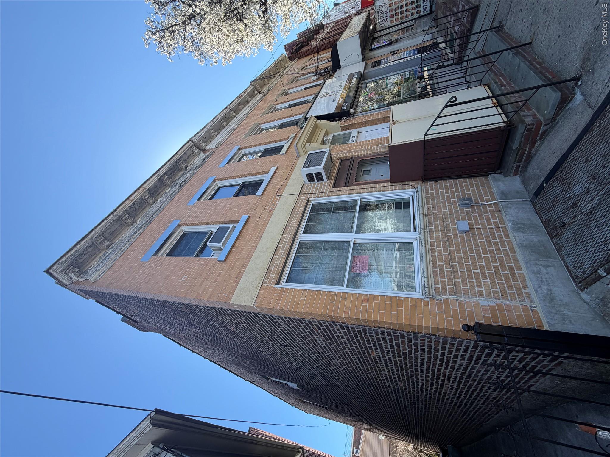 50-05 108th Street Queens, NY 11368 - Photo 3 of 16 a front view of a house
