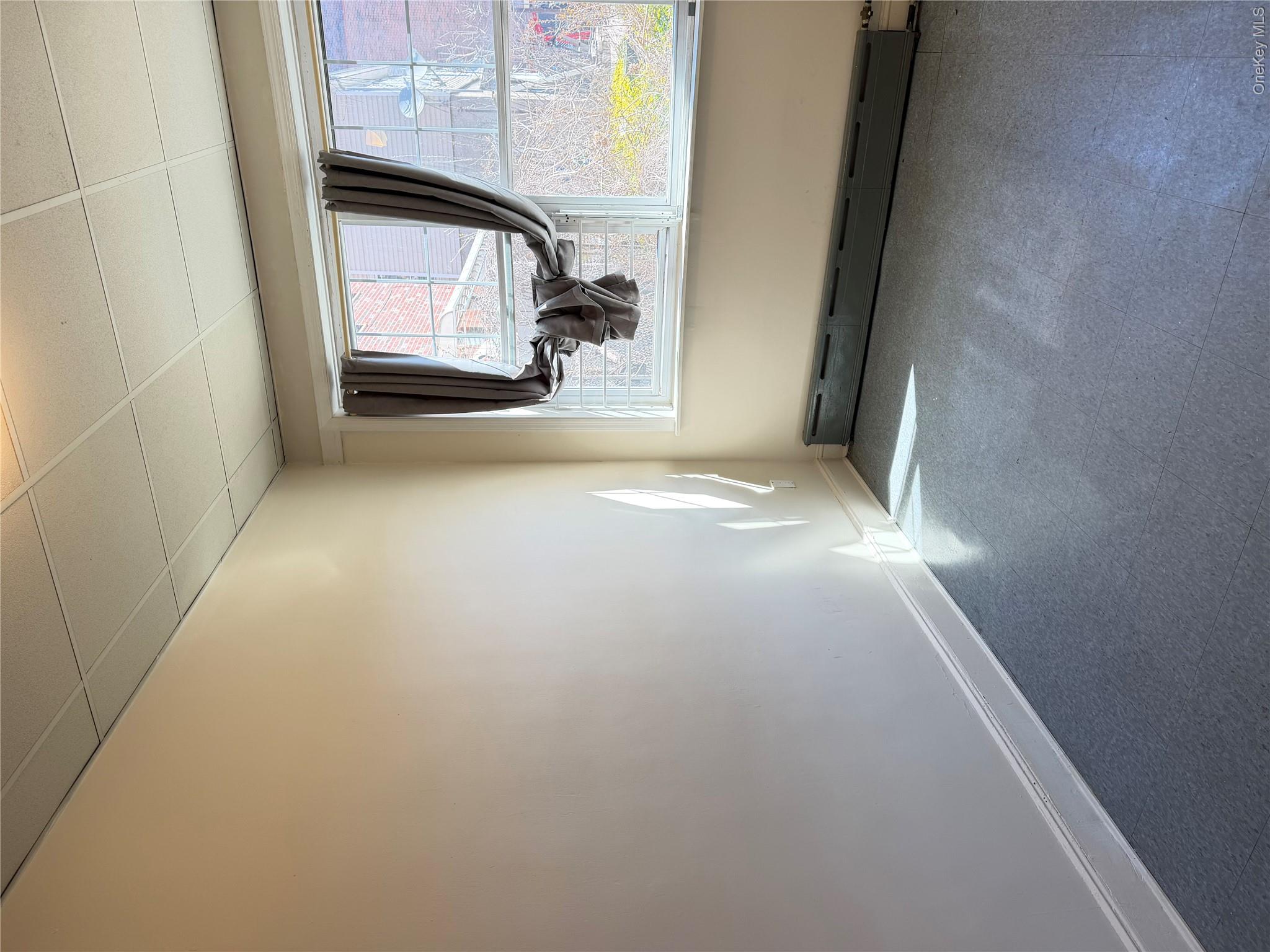 50-05 108th Street Queens, NY 11368 - Photo 8 of 16 a view of a room with a large window