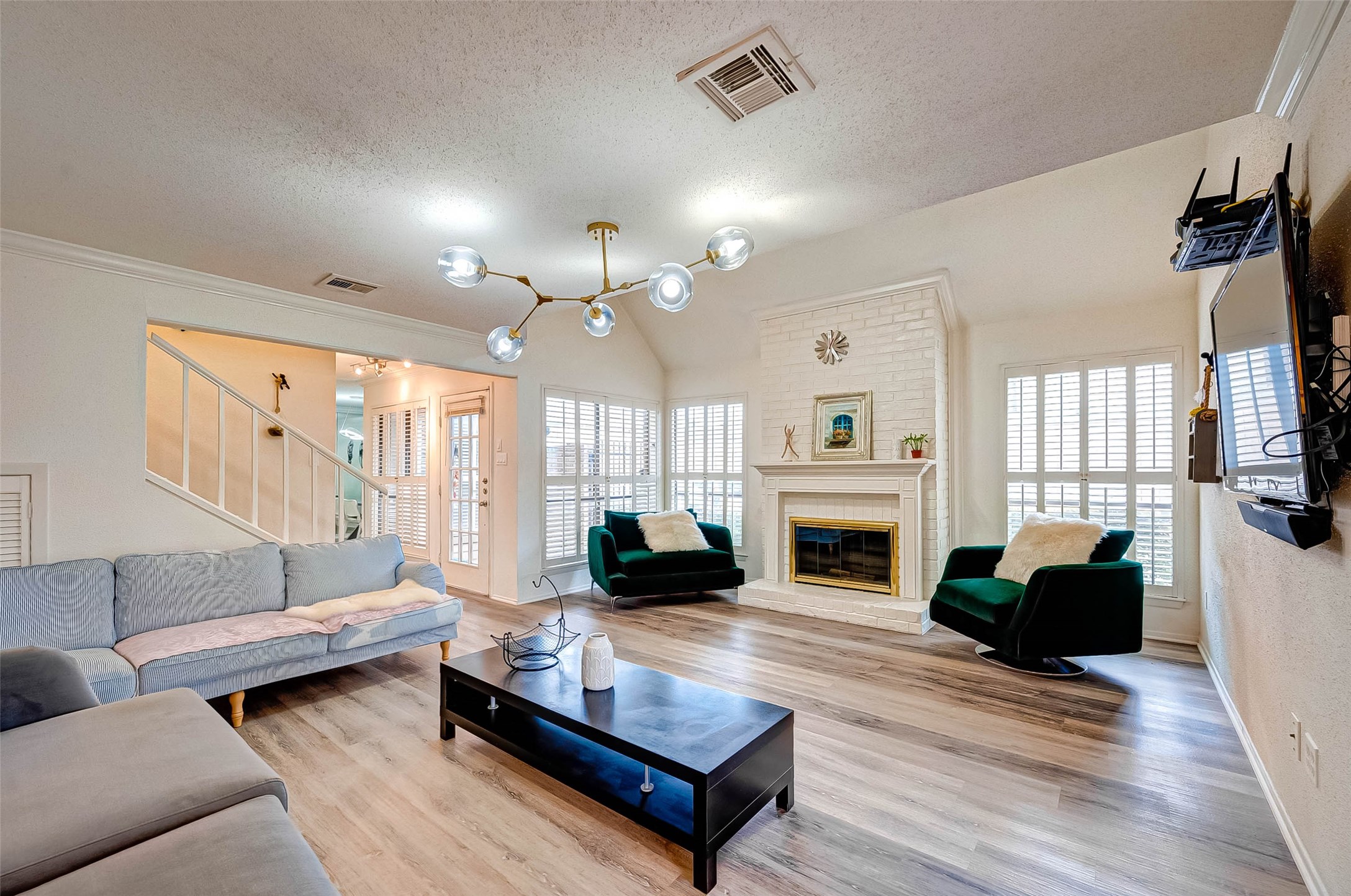 1908 Augusta Drive, Unit 7 Houston, TX 77057 - Photo 8 of 33 a living room with furniture fireplace and a large window