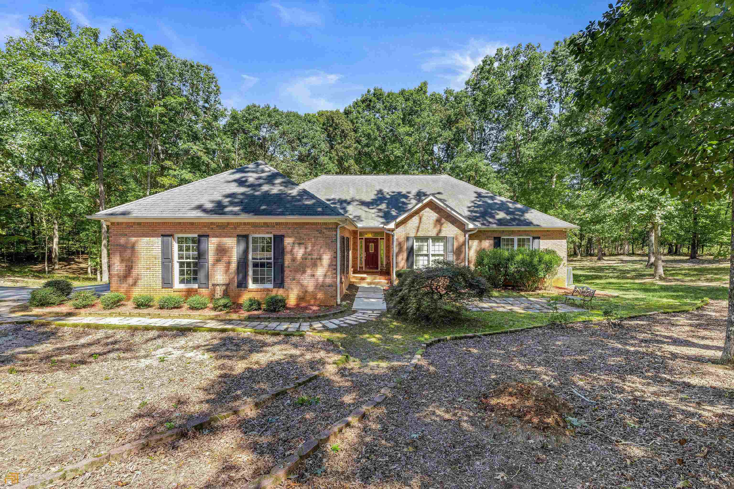 485 Paradise Park Road Cornelia, GA 30531 - Photo 1 of 1 a front view of a house with garden