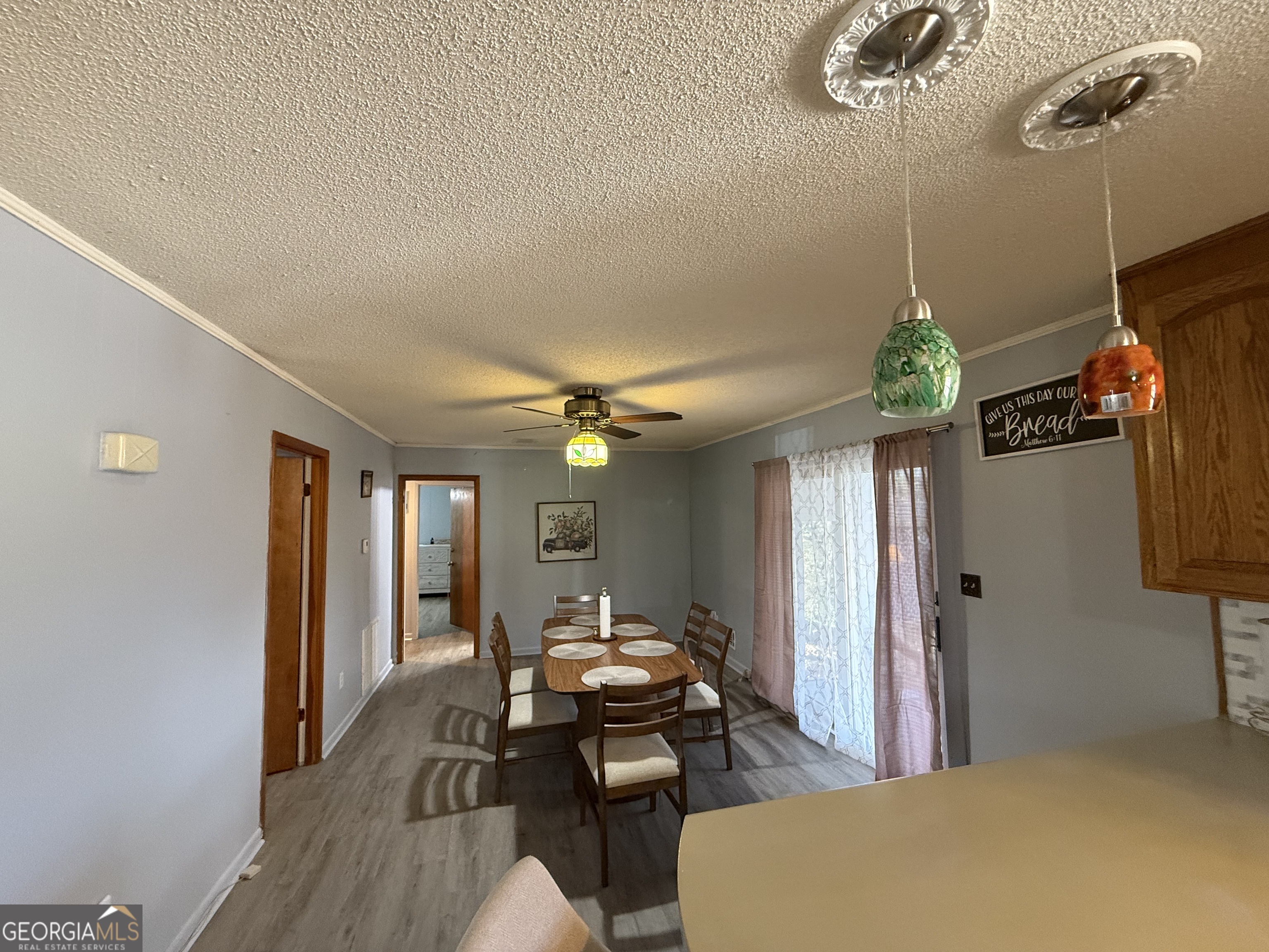 102 Hemlock Street Warner Robins, GA 31093 - Photo 14 of 32 a dining room with furniture and wooden floor