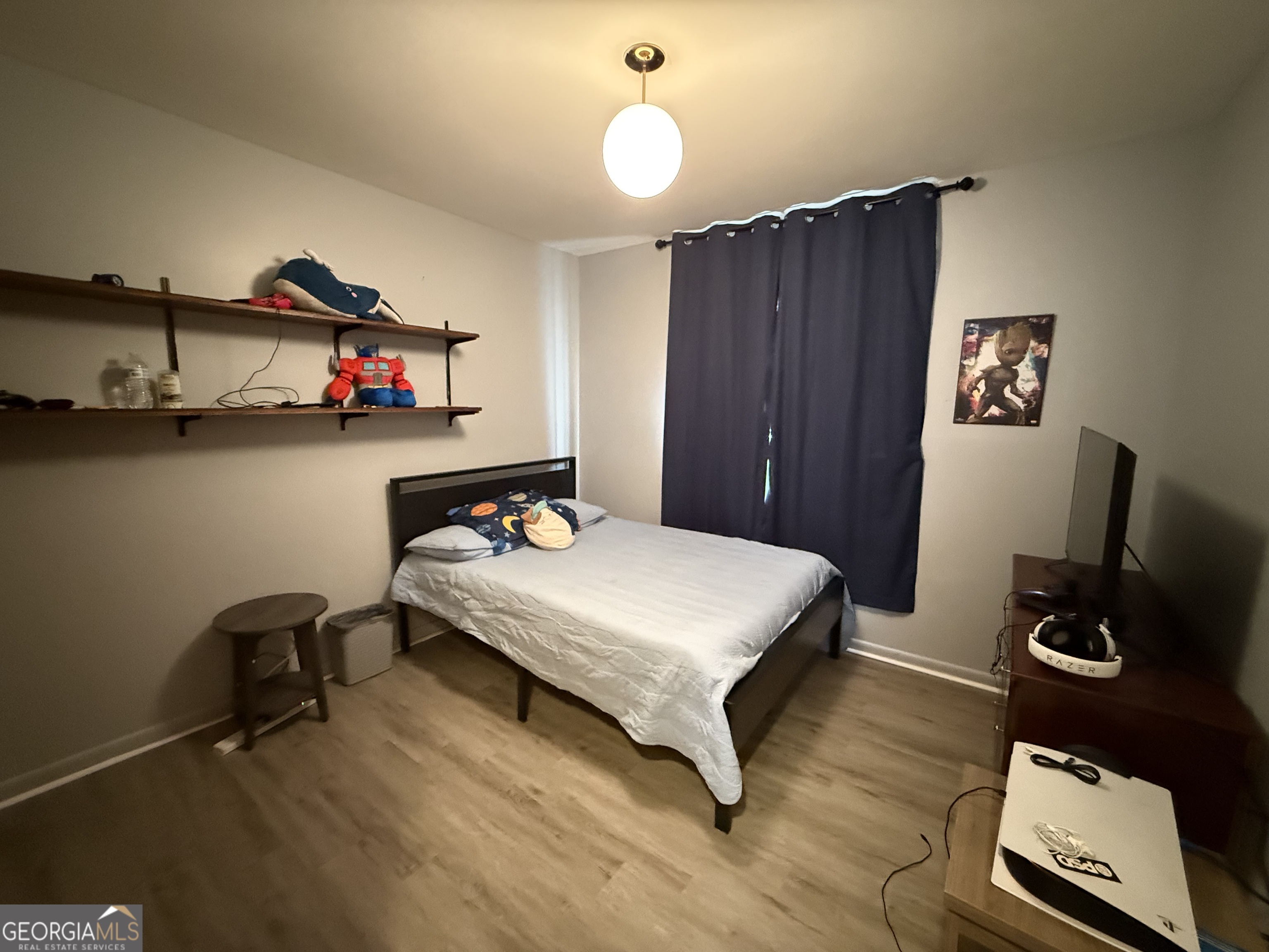 102 Hemlock Street Warner Robins, GA 31093 - Photo 18 of 32 a bedroom with a bed and a flat screen tv