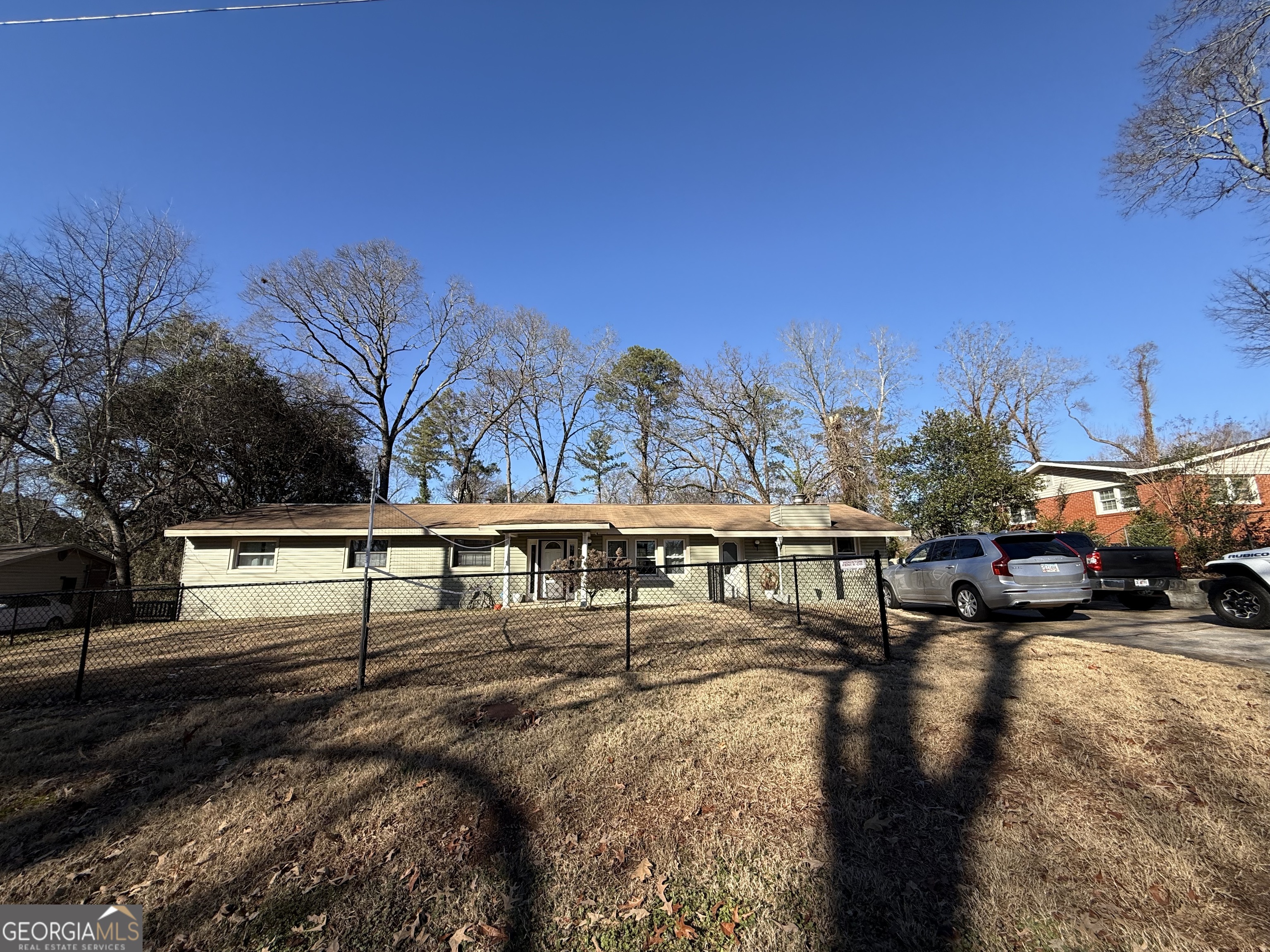 102 Hemlock Street Warner Robins, GA 31093 - Photo 2 of 32 a view of swimming pool with outdoor seating and trees in the background
