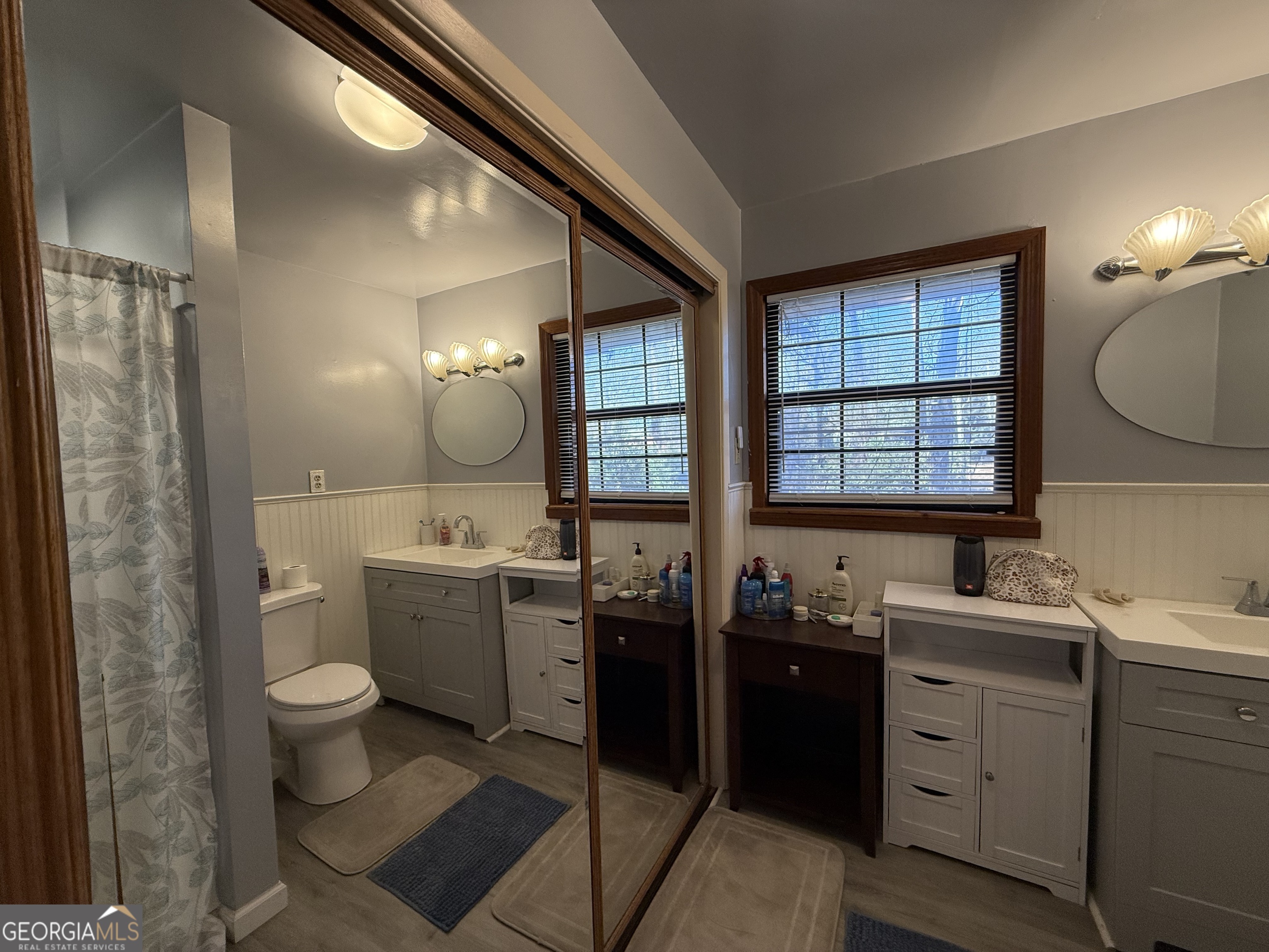 102 Hemlock Street Warner Robins, GA 31093 - Photo 23 of 32 a bathroom with a double vanity sink toilet and a mirror