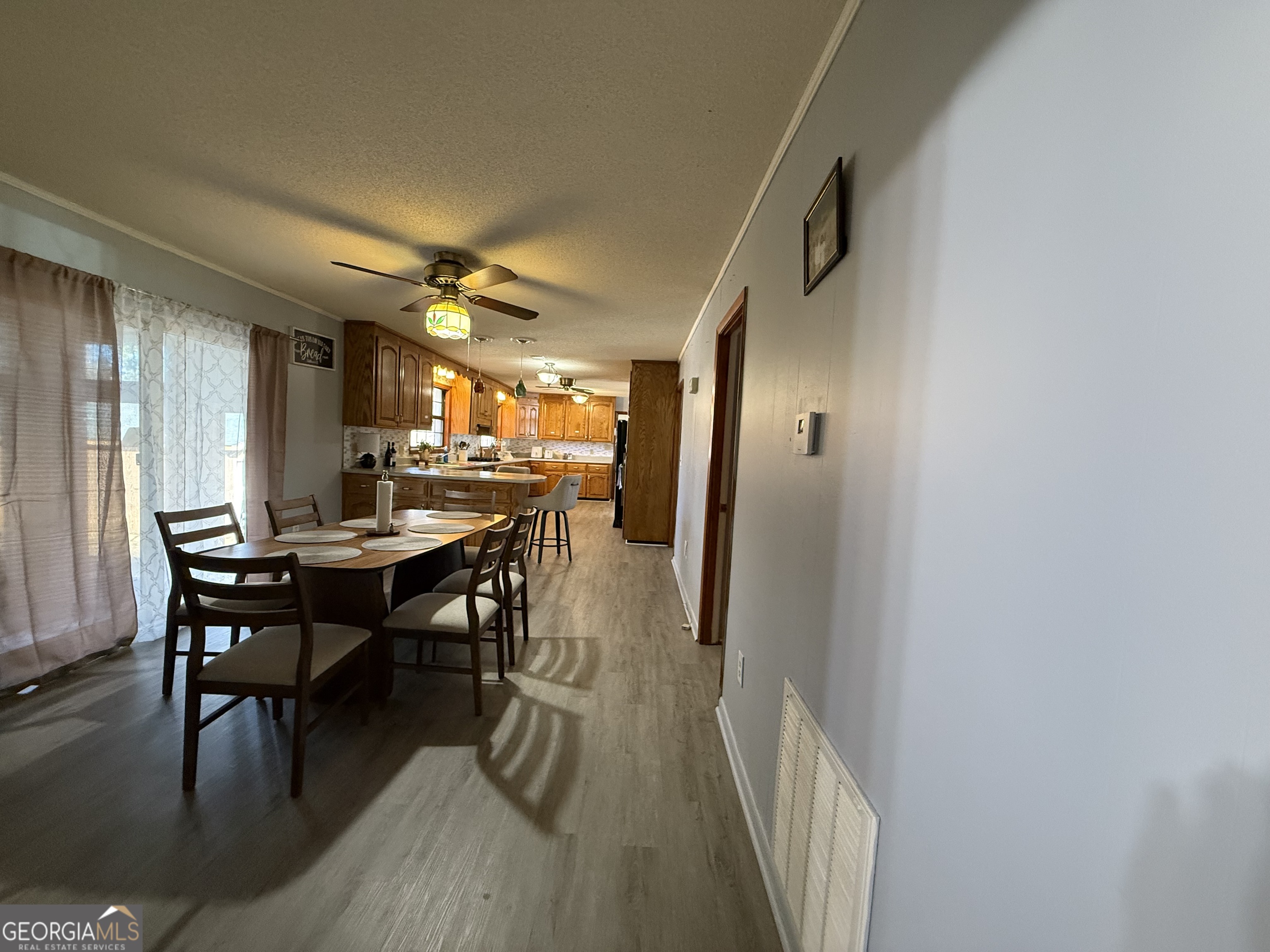 102 Hemlock Street Warner Robins, GA 31093 - Photo 26 of 32 a view of a dining room with furniture and wooden floor